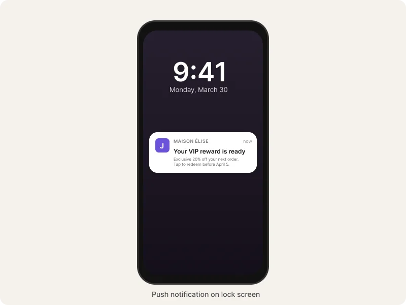 Push notification on iPhone lock screen from fashion brand announcing VIP reward